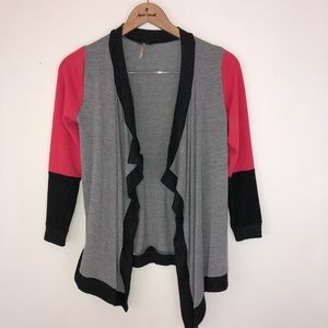 Gray, hot pink and light pink throw on a sweater